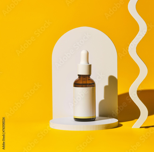 minimalist presentation of a cosmetic oil bottle, elegantly placed against a vibrant yellow backdrop, accentuated by playful shadows and curves