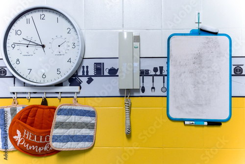 shopping list mockup. Clock, handles and whiteboard on a tiled wall