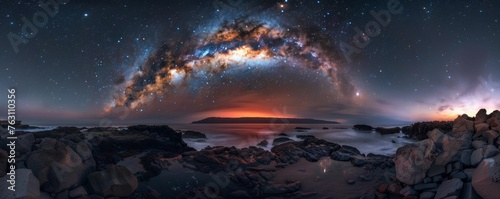 Panoramic view of the milky way over a rocky beach