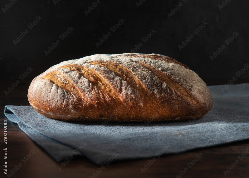 Homemade sourdough bread. Fresh Sourdough bread on a black background.