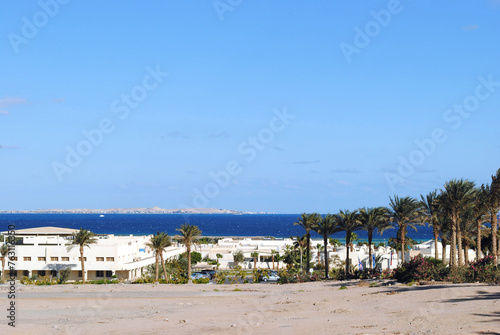 Sunny resort beach on the Red Sea in Hurghada, Egypt. Landscape with beach