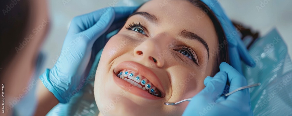 Woman with braces on her teeth undergoing orthodontic treatment ...