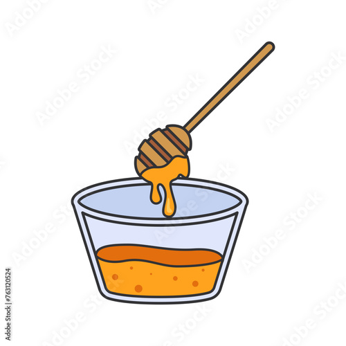 Honey dipper in glass bowl