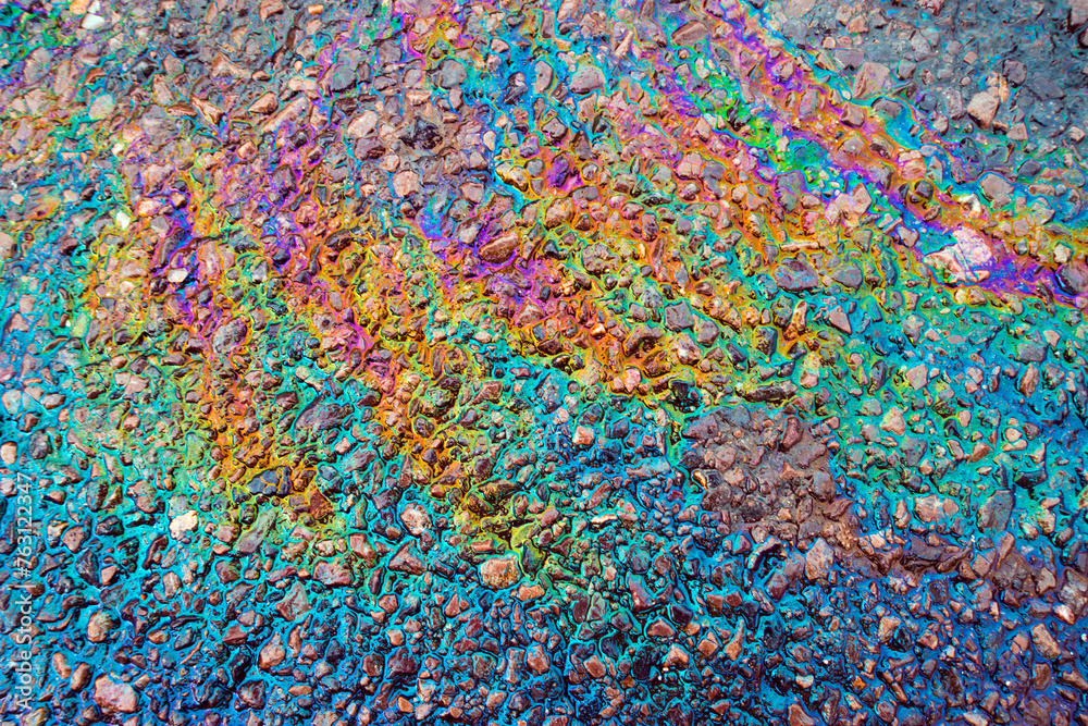 Leaked Gasoline Oil Slick or Petrol Rainbow Enviromental leak On Tarmac Road