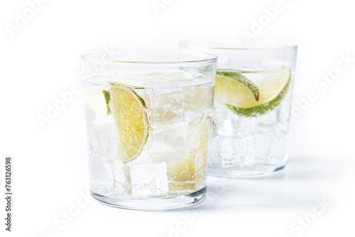 Glass of vodka tonic cocktail isolated on white background