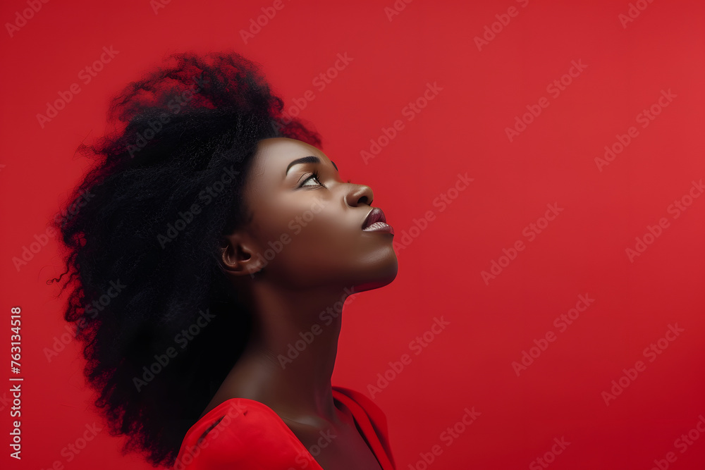 Portrait of a confused puzzled minded African American young woman in red tank top isolated on a red background, with copy space. Contemplation doubt concept Portrait of a confused puzzled minded African American young woman in red tank top isolated on a red background, with copy space. Contemplation doubt concept
