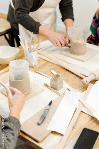 Ceramic Crafting: Women Molding Clay Vases