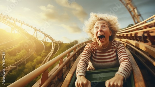 Happy senior woman on roller coaster having fun, with copy space for text or captions © chelmicky