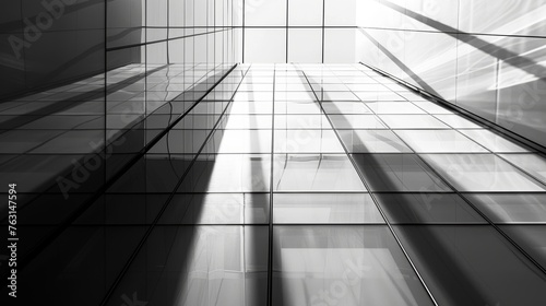 Modern glass architecture featuring reflections and high contrast light and shadows