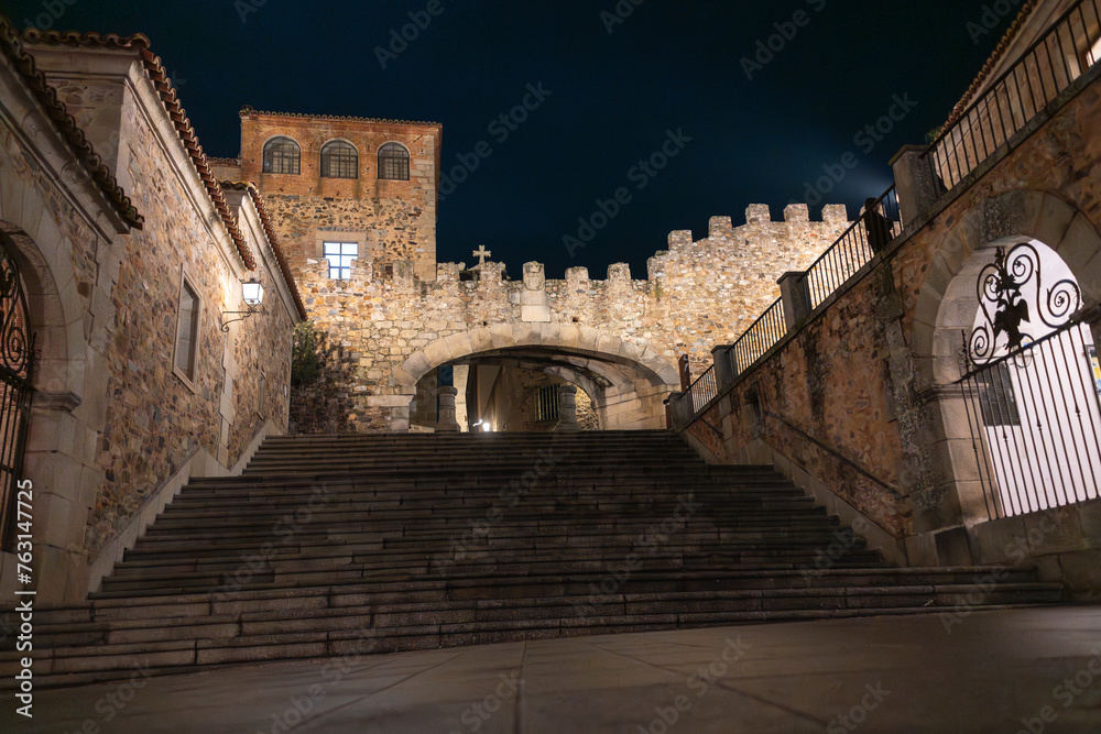 Nighttime stroll through the historic streets of Caceres old town, Spain
