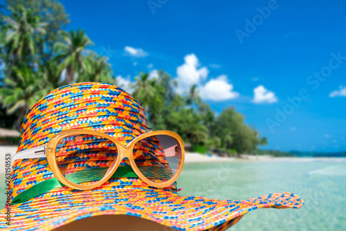 Straw hat on the beach with sea and sky on island background, Summer vacation concept	