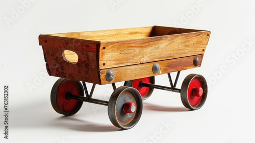 Children's wood and metal wagon toy isolated on a white background