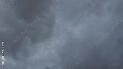 A fairly dark column of cloud passes through the cloudy sky photo