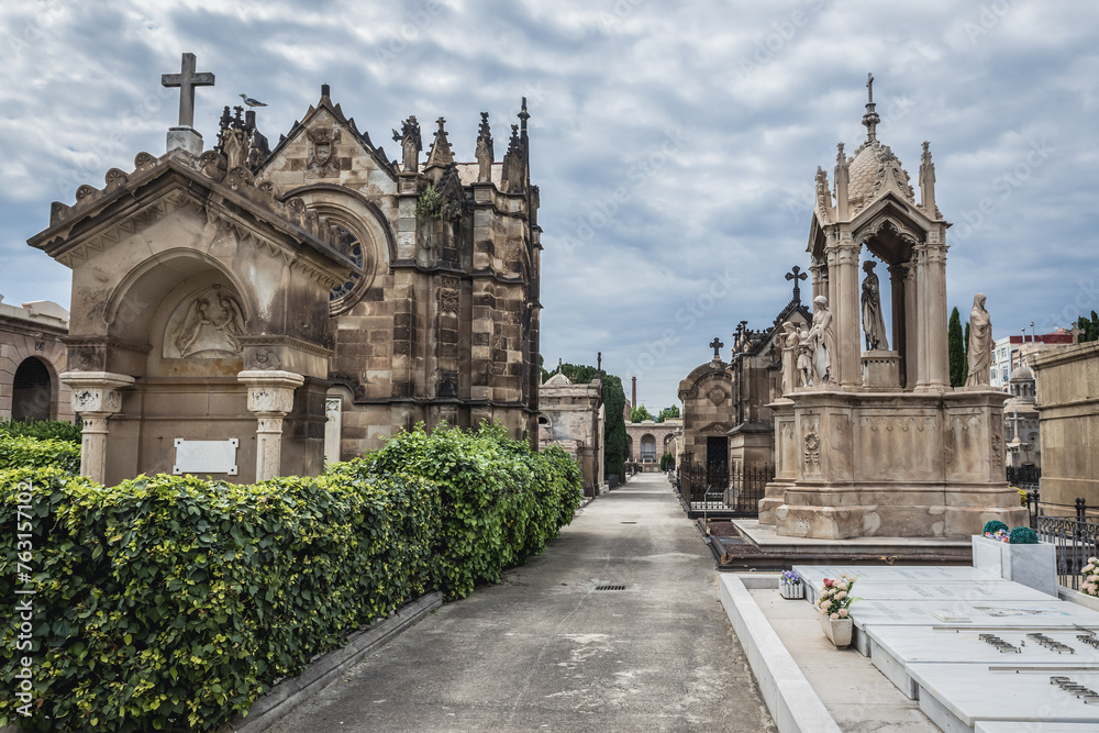 Alley with tombs on Poblenou Cemetery in Poblenou neighbourhood of Barcelona, Spain