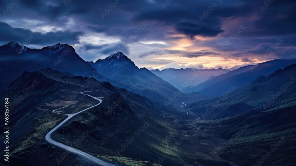 Mystical mountain landscape with winding road through the valley. High quality photo