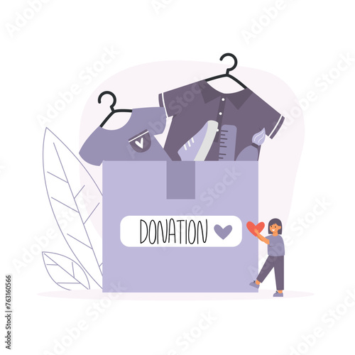 Charity donation concept. Little girl holding heart near cardboard box with donate clothes and goods