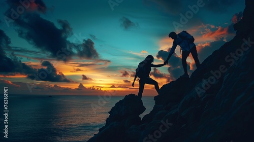 Couple hiking help teamwork and trust silhouette in mountains, sunset and ocean. Male and woman hiker helping each other on top mountain looking at beautiful night landscape motivation and inspiration