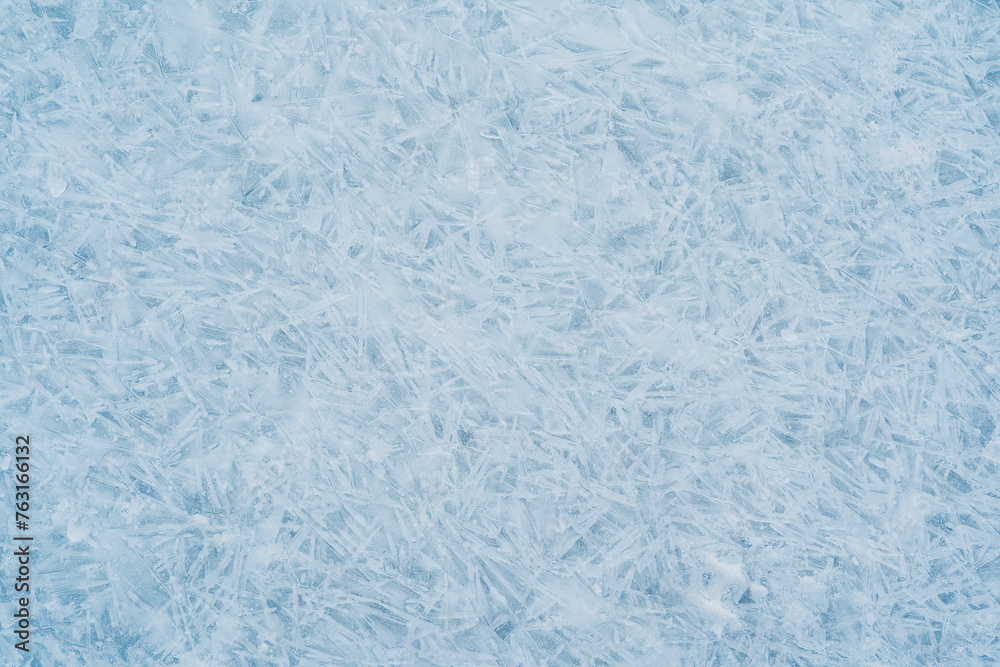 Close-up photo of transparent light blue ice of Baikal lake with white frost ornament. Great backdrop for your design with copy space. Top view. Close-up photo of transparent light blue ice of Baikal lake with white frost ornament. Great backdrop for your design with copy space. Top view.
