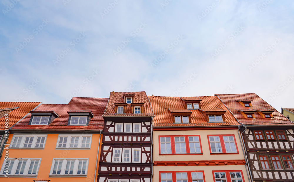 spring trip to Europe. Travel and German sightseeing locations. scenic view to facade of old historic houses somewhere in Erfurt city, Traditional half-timbered houses makes cozy and fairy tail mood