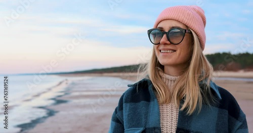 woman enjoying nature on relaxing beach walk. mental health and wellbeing photo