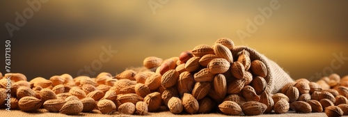 Heap of organic peanuts on defocused background with copy space for text - organic nuts banner