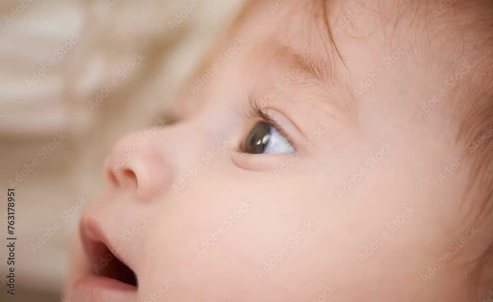 Newborn, closeup and baby with thinking for curiosity, childhood development and growth in bedroom. Adorable, healthy kid and cute infant with smile to relax, wonder or waking up in nursery at home Newborn, closeup and baby with thinking for curiosity, childhood development and growth in bedroom. Adorable, healthy kid and cute infant with smile to relax, wonder or waking up in nursery at home