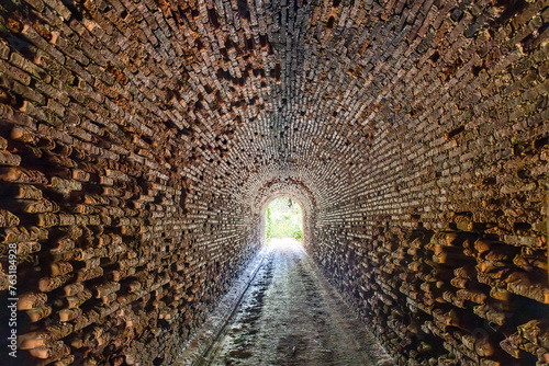 Old railway tunnel in the hiking route of the water mills along the Odiel river from Sotiel Coronada, in Huelva province, Andalusia, Spain photo