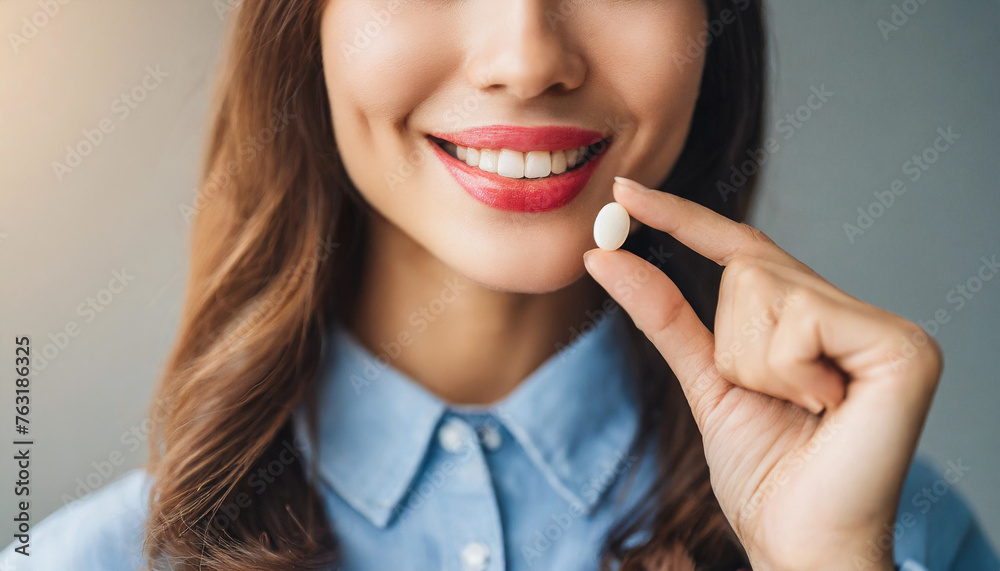hands near woman's lips with hand holding diet pill, symbolizing beauty, health, and lifestyle choices hands near woman's lips with hand holding diet pill, symbolizing beauty, health, and lifestyle choices