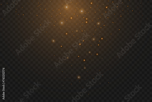 Christmas falling golden lights. Magical abstract gold dust and glare. Festive Christmas background.