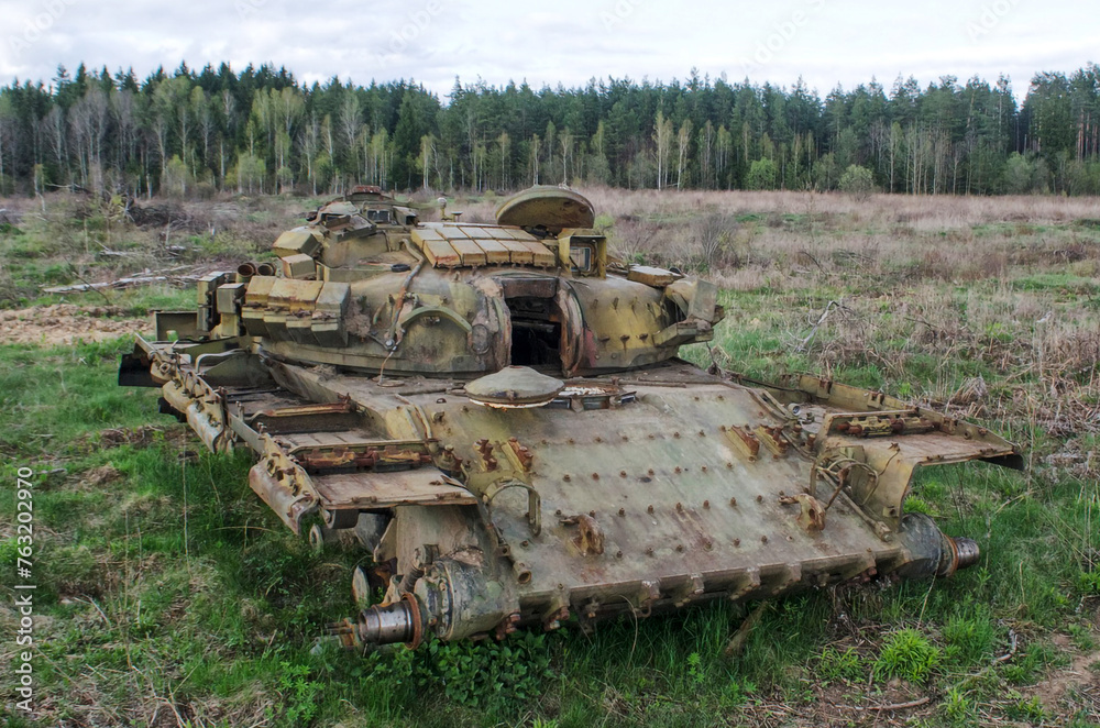 Abandoned armored combat vehicle after burnt. Destroyed battle tank ...