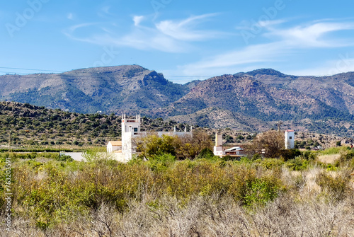 Villa on mountains landscape. Rustic Home in field. Countryside with village house. Classic Spanish villa in countryside. Traditional farmhouse in Spain Mediterranean. Spanish farm house in field.