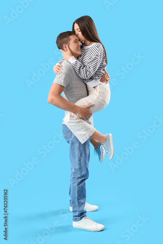 Happy young couple kissing ...