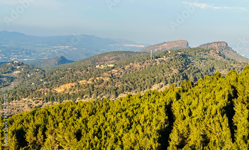 Mountains landscape  nature scenery. Green trees and huge cobblestones in mountain. View from Mola de Segart mountain  Sierra Calderona  Spain. Landscape of mountain valley. Hiking in canyon. Trekking