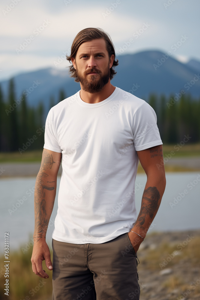Male model posing outdoors with plain white canvas t-shirt mockup