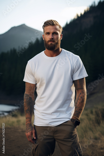 Male model posing outdoors with plain white canvas t-shirt mockup