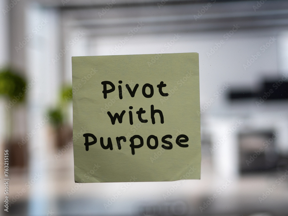 Post note on glass with 'Pivot with Purpose'. Post note on glass with 'Pivot with Purpose'.
