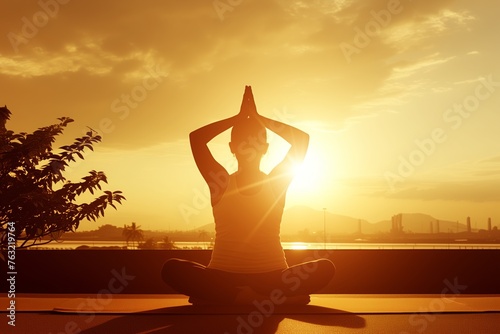 Sunset yoga session with silhouette of a woman practicing on the rooftop