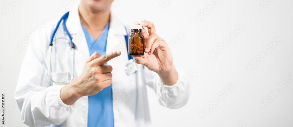 Hand in a Lab Coat and a holding a white pill bottle Hand in a Lab Coat and a holding a white pill bottle