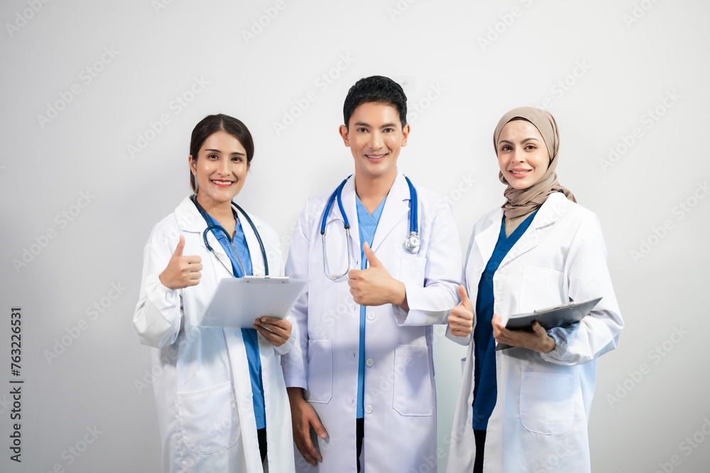 Successful team of medical doctors looking at camera and smiling while standin. Health, professional and people team. Successful team of medical doctors looking at camera and smiling while standin. Health, professional and people team.