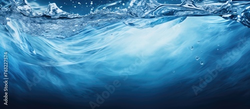 A closeup of a splash of liquid azure water in the ocean  capturing the natural fluidity and beauty of the marine atmosphere  a stunning atmospheric phenomenon in the aquatic landscape