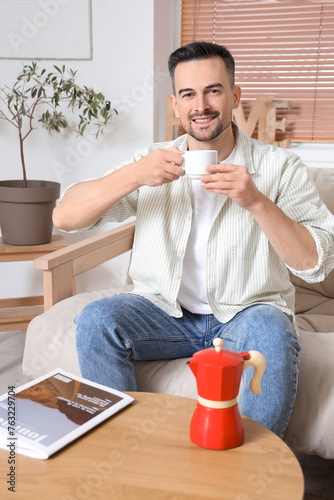Handsome man drinking espre...