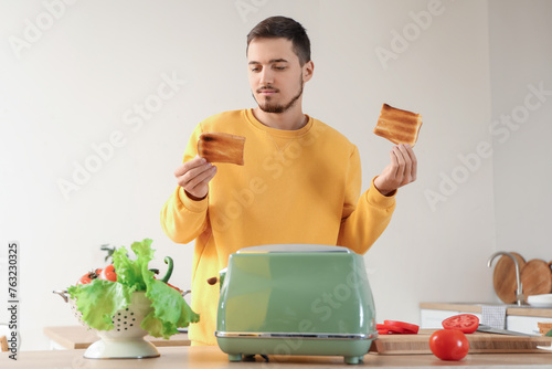 Young man with crispy toast...