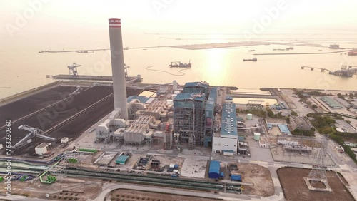 Heavy industrial coal power electricity plant with chimney and pipes, lignite coal product mass ready to be energy for electricity power plant