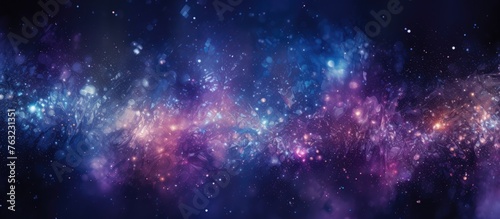 The sky resembles a galaxy with a myriad of purple, violet, and electric blue stars. Its a beautiful pattern of astronomical objects in shades of magenta, surrounded by gas and water photo