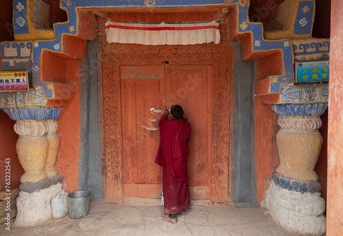 Buddhist Monk enters Temple © Aaron