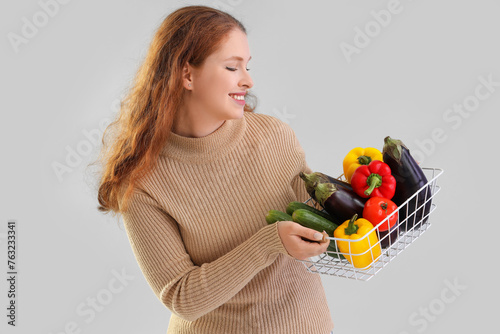 Young woman with basket of ...