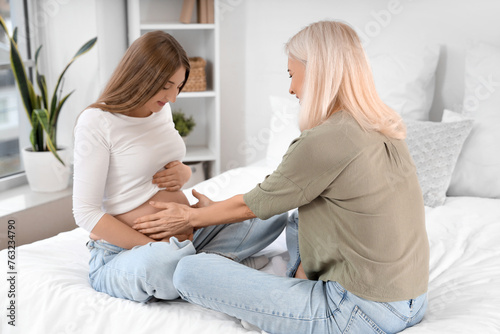Pregnant woman and mature m...