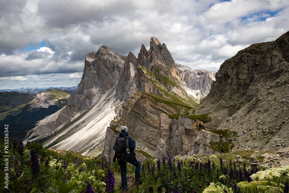 Fototapeta premium Mountain view with climber, Seceda mountain, Dolomites, Italy.