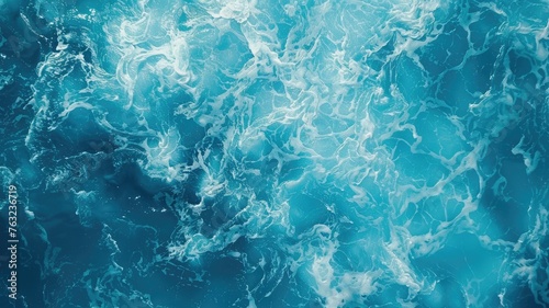 Overhead view of foamy ocean waves - This image captures the dynamic texture of ocean waves from above, exhibiting the power and beauty of the sea