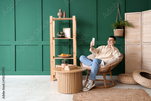 Young man using mobile phon...